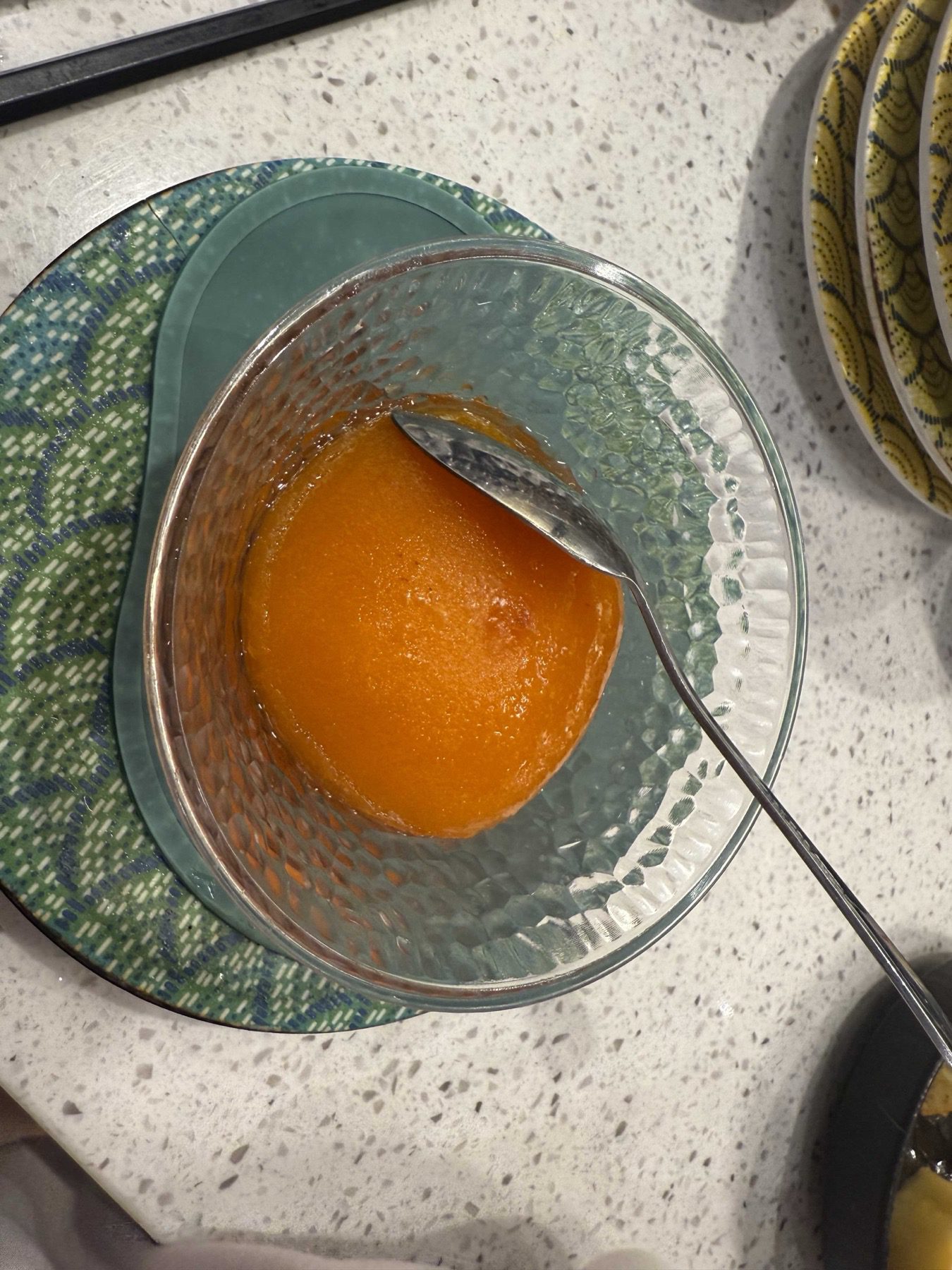 Citrus sorbet served in a textured glass bowl with a spoon at Sushi Ian Wirye