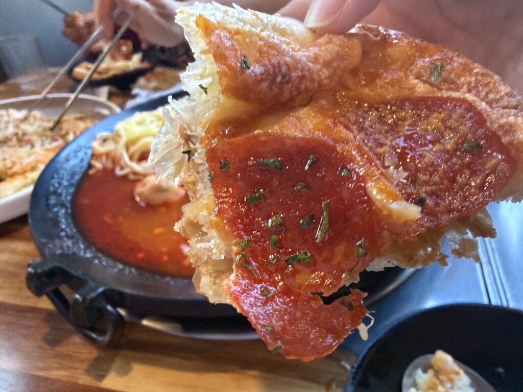 A slice, showing the flaky pastry base