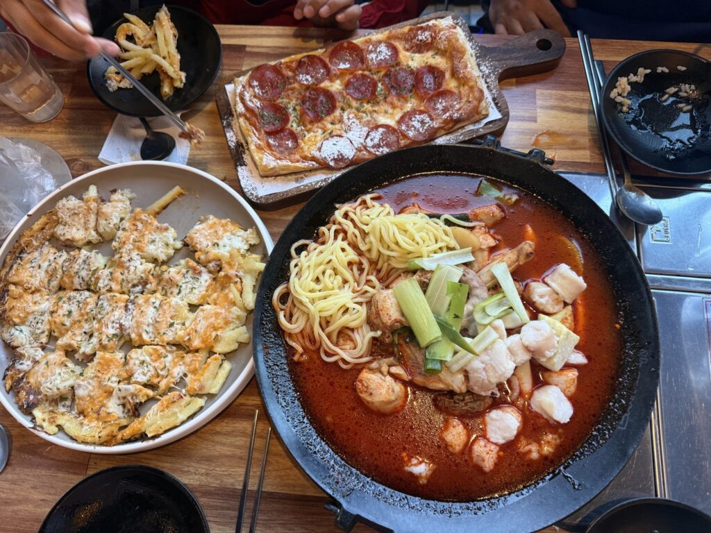 Our table: gopdori-tang in the middle, cheese potato on the left and the pepperoni pizza at the back