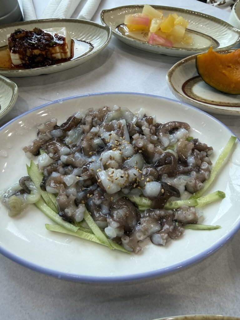 Nakji tangtangi, chopped raw octopus over cucumber