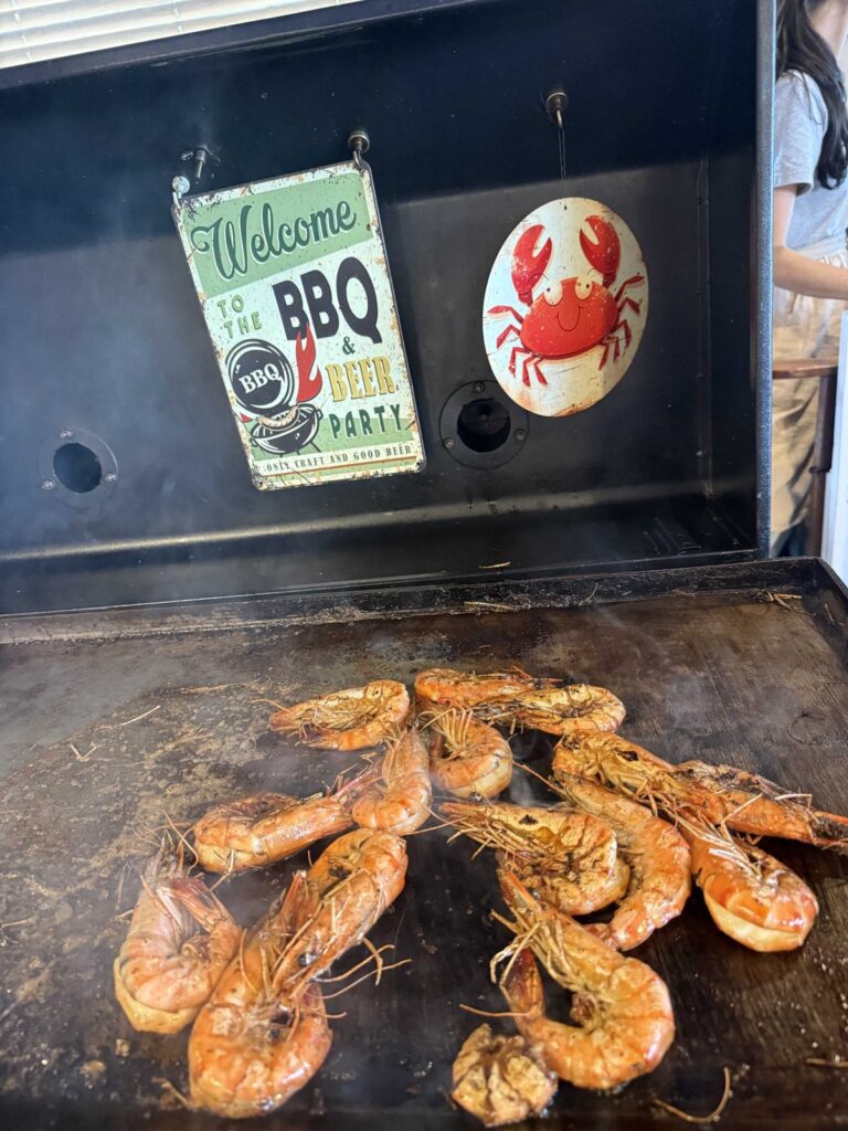 King prawns cooking on the griddle by the entrance