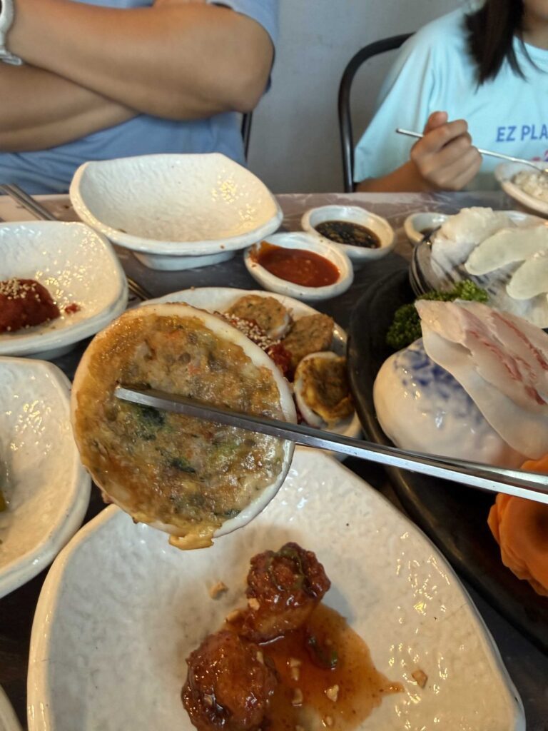 Squid sundae, with fried chicken bites on the plate below